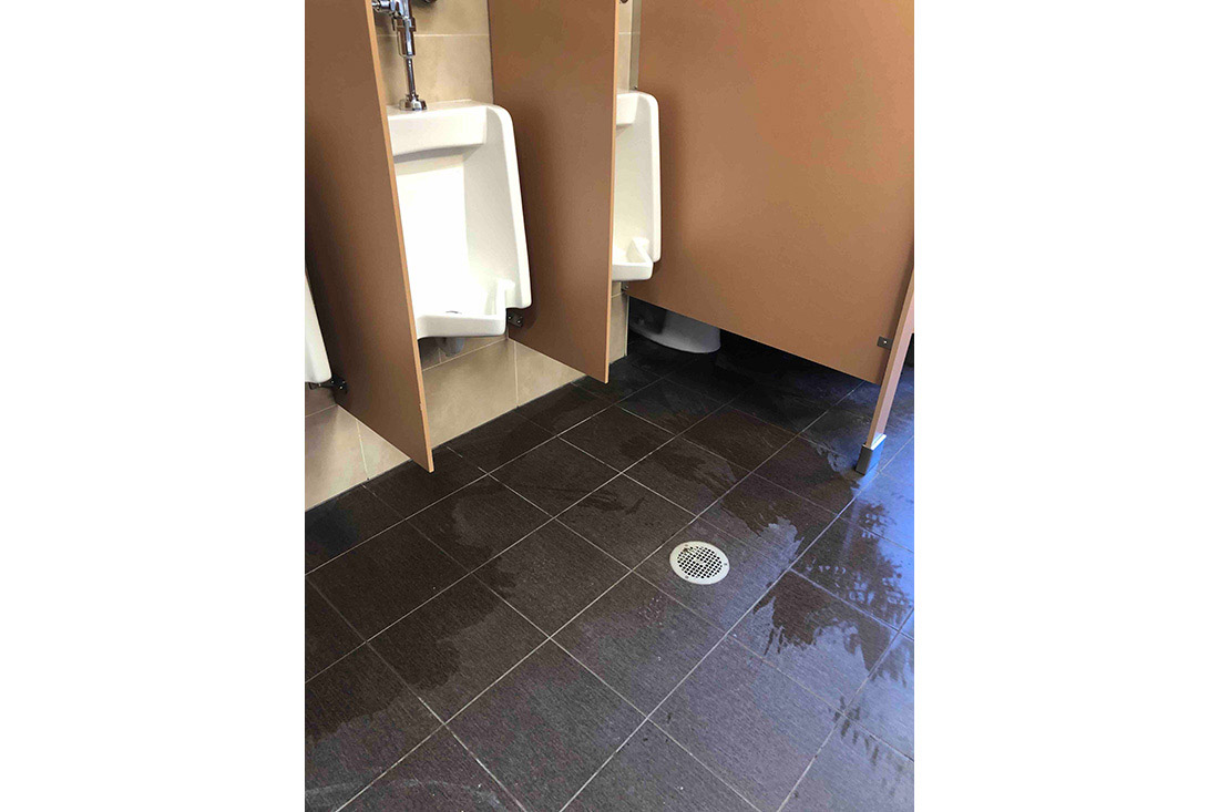 photo showing urinals and tiled floor