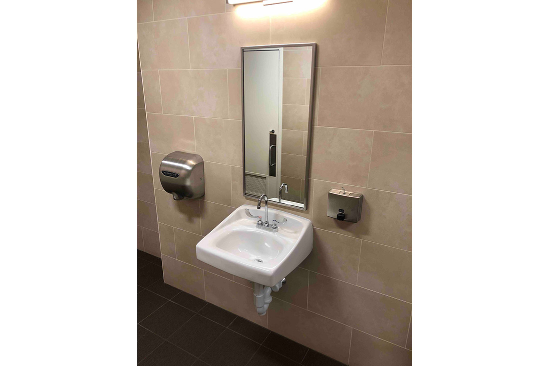photo showing single bathroom sink and mirror